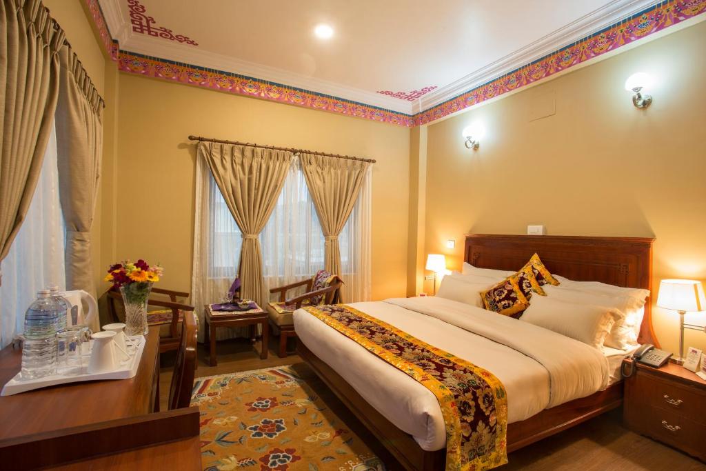 Postel nebo postele na pokoji v ubytování Hotel Harmika