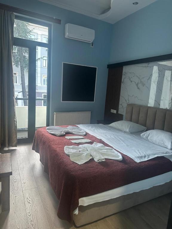 Postel nebo postele na pokoji v ubytování batummetropol hotel