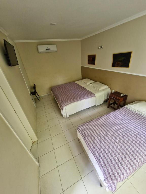 Postel nebo postele na pokoji v ubytování Ecopousada Miriti