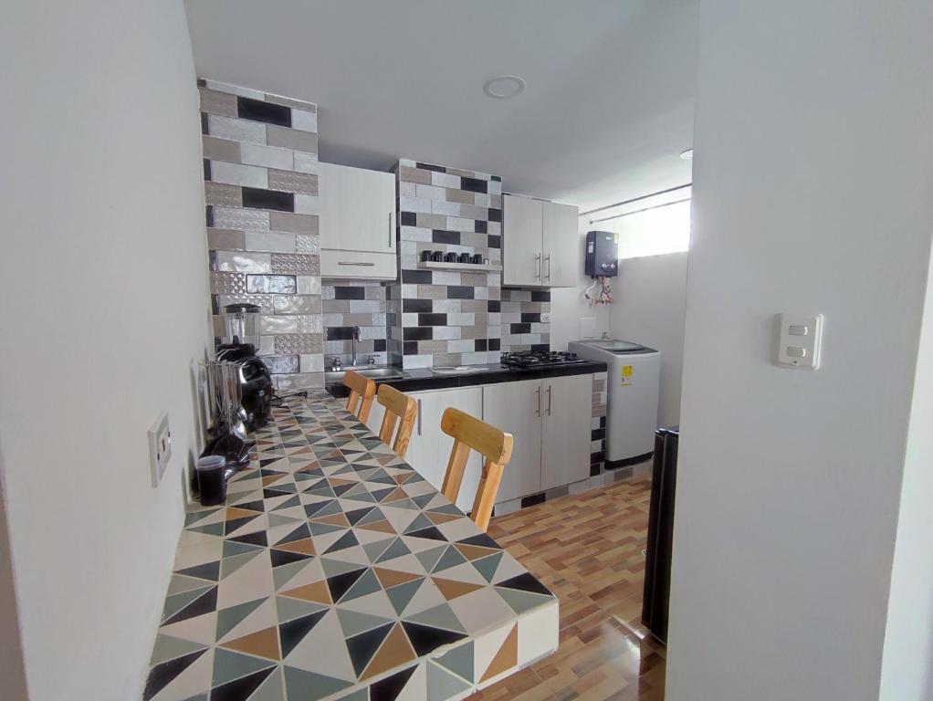 Kuchyň nebo kuchyňský kout v ubytování Apartahotel JDK