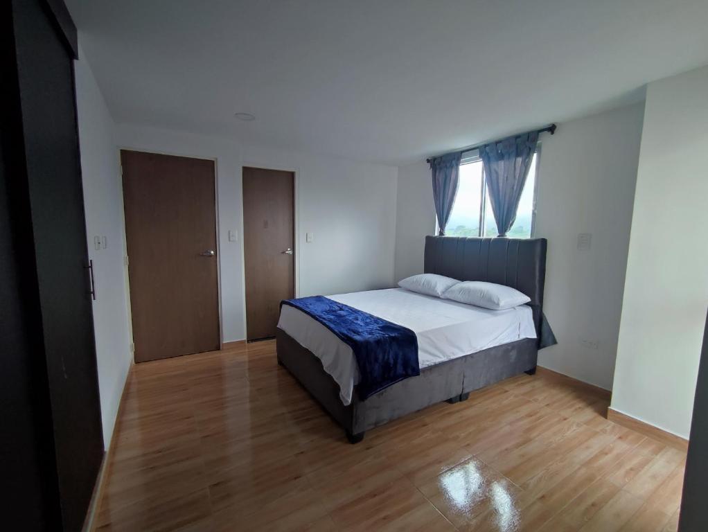 Postel nebo postele na pokoji v ubytování Apartahotel JDK