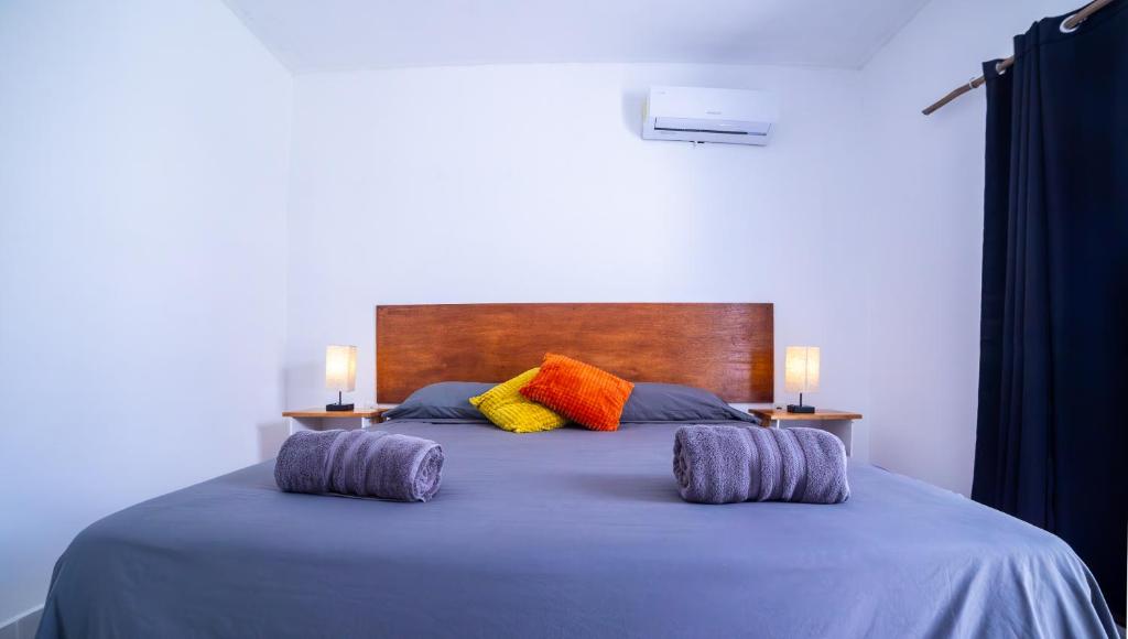 Postel nebo postele na pokoji v ubytování Terra Cozumel