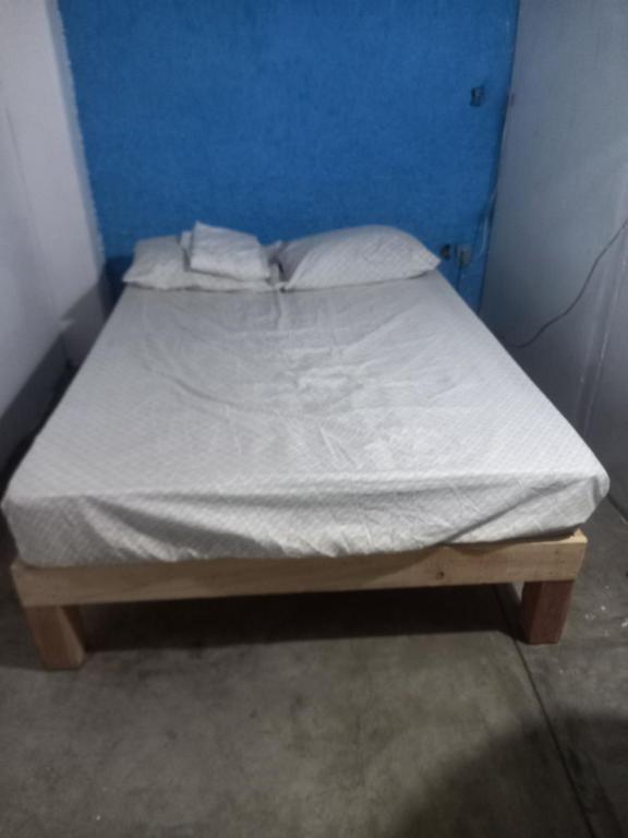 Кровать или кровати в номере Hostal Puntacana Vallarta