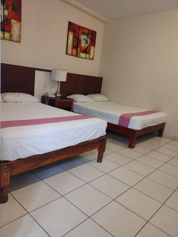Postel nebo postele na pokoji v ubytování Hotel Tradicional Savaro SA de CV