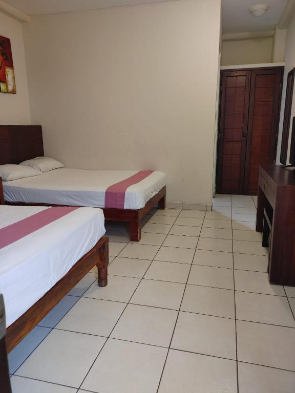 Postel nebo postele na pokoji v ubytování Hotel Tradicional Savaro SA de CV