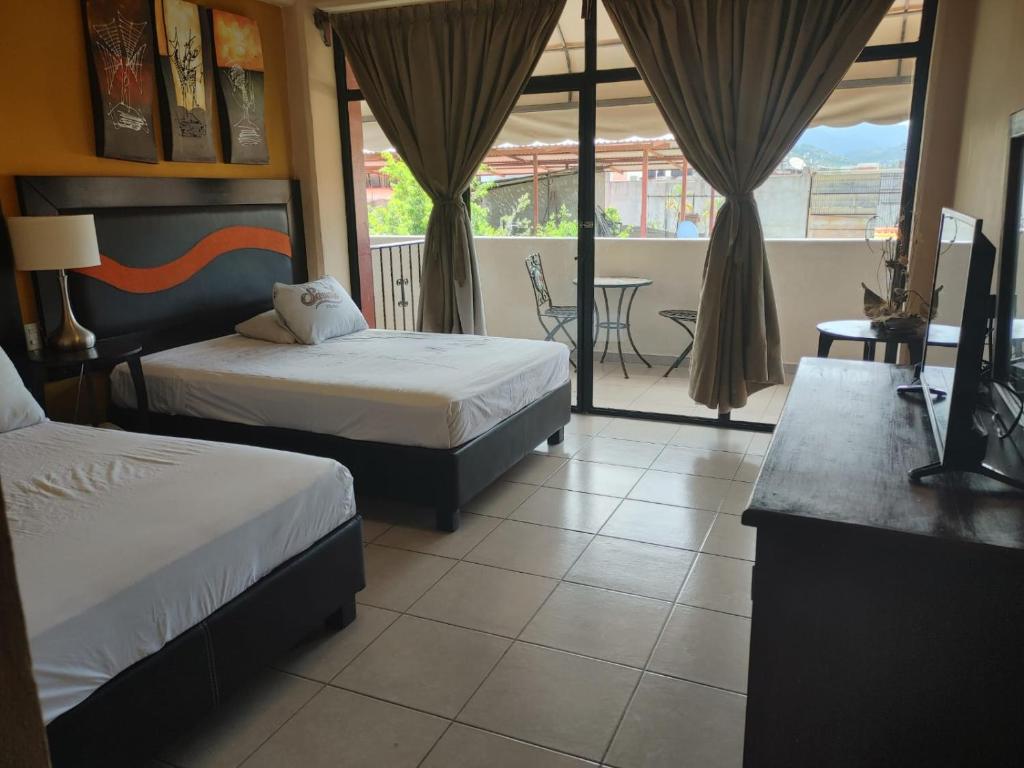 Postel nebo postele na pokoji v ubytování Hotel Tradicional Savaro SA de CV