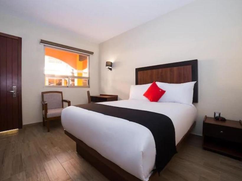 Postel nebo postele na pokoji v ubytování Hotel Colonial Acopinalco Inn