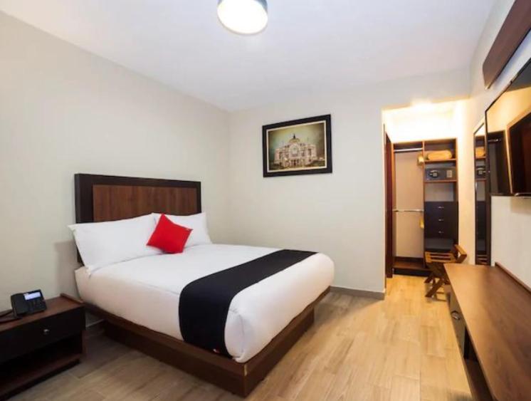 Postel nebo postele na pokoji v ubytování Hotel Colonial Acopinalco Inn