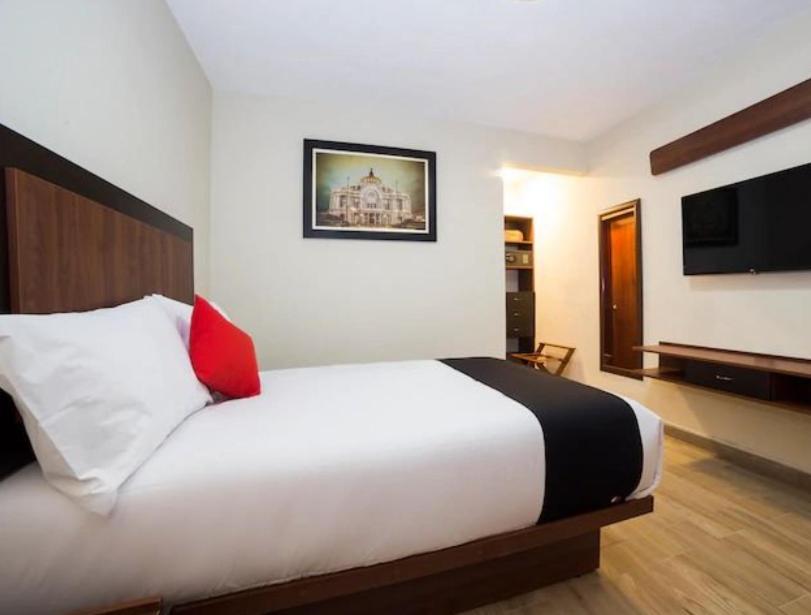 Postel nebo postele na pokoji v ubytování Hotel Colonial Acopinalco Inn