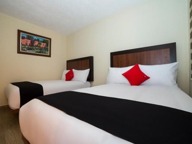 Postel nebo postele na pokoji v ubytování Hotel Colonial Acopinalco Inn
