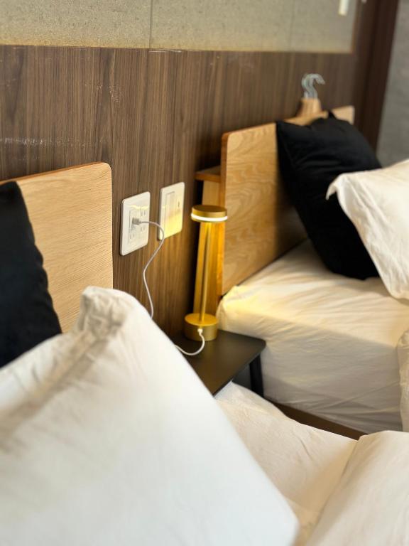 Postel nebo postele na pokoji v ubytování e-hostel 心斎橋 双床房
