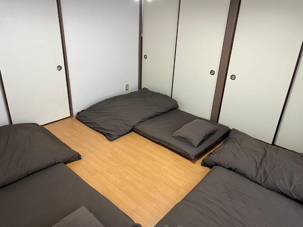Postel nebo postele na pokoji v ubytování Guesthouse NALUノ道