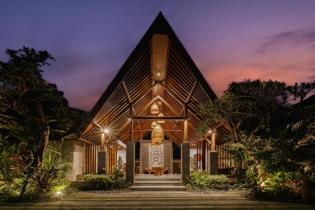 a church with a large building with lights on it at Elitya Ubud Villa in Ubud