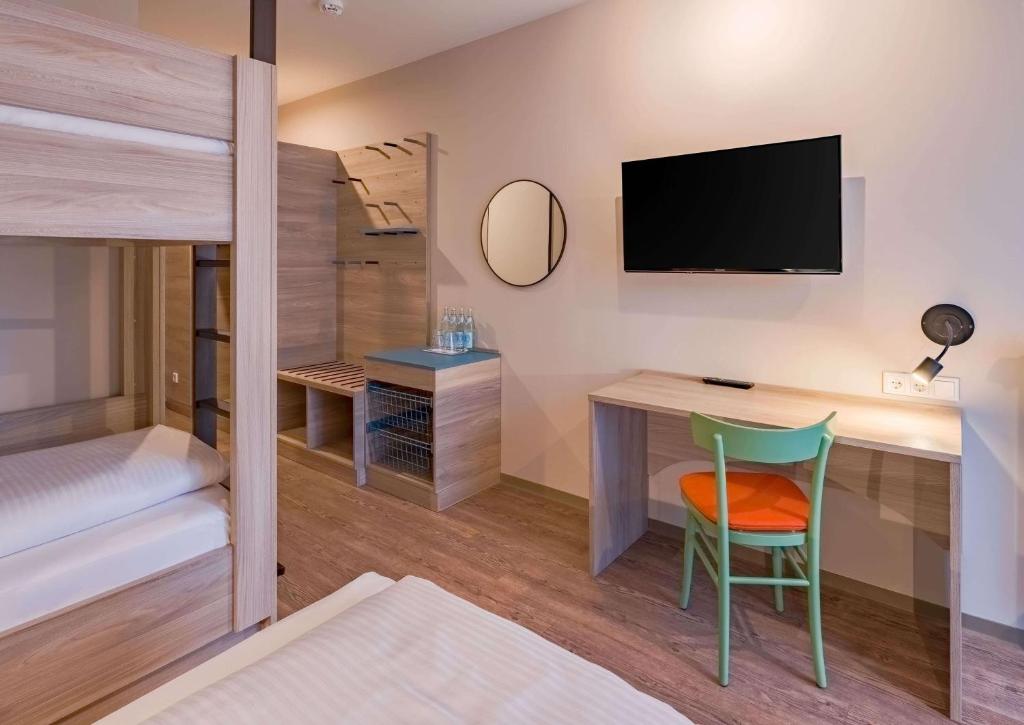 Letto o letti in una camera di Ramada Encore by Wyndham Munich Messe