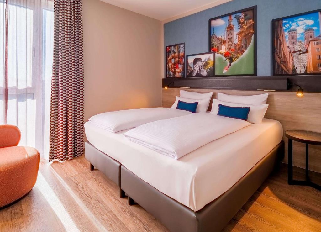 Letto o letti in una camera di Ramada Encore by Wyndham Munich Messe