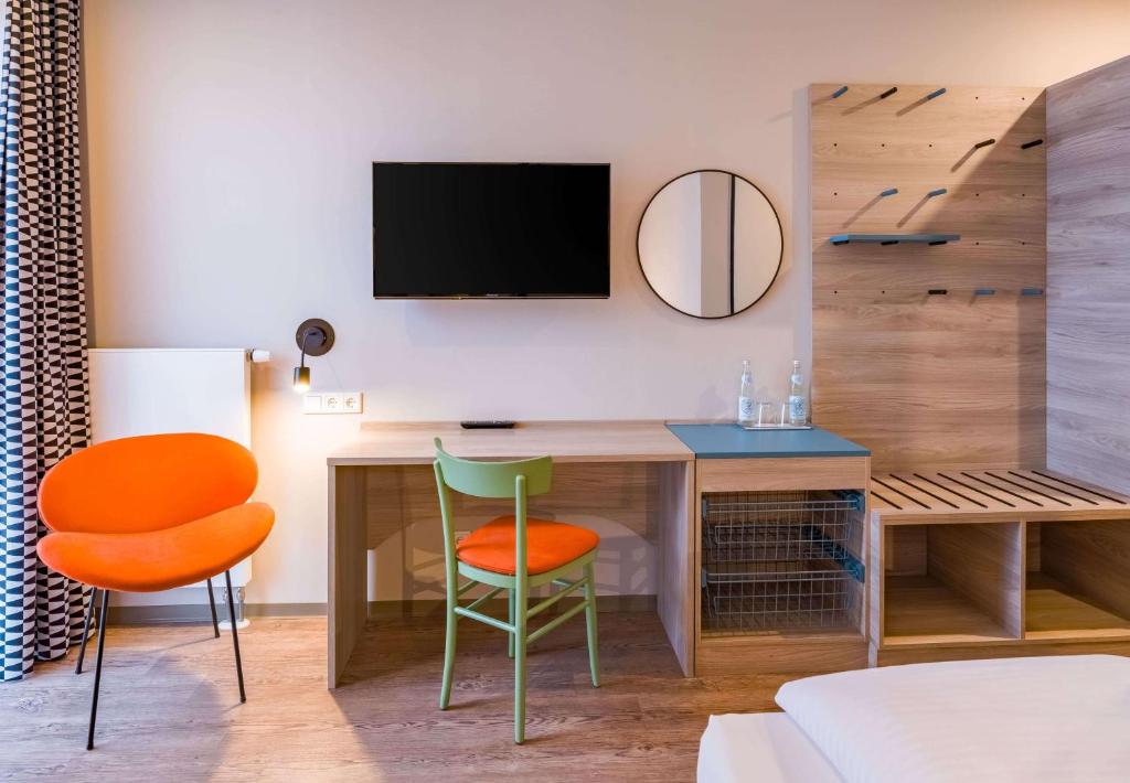 TV o dispositivi per l'intrattenimento presso Ramada Encore by Wyndham Munich Messe