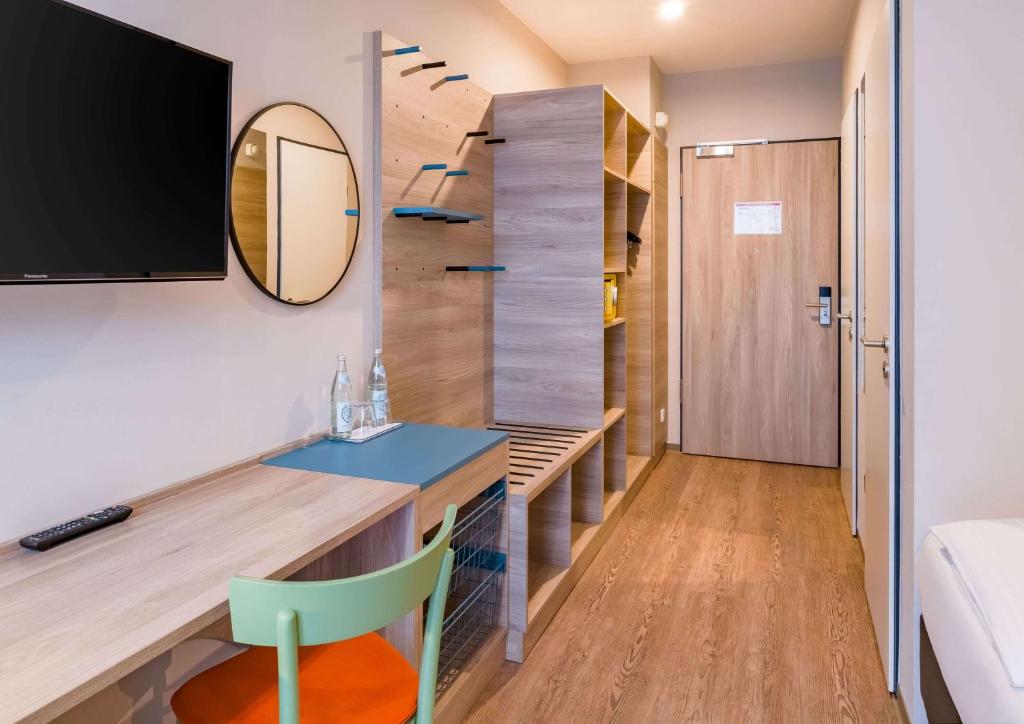 TV o dispositivi per l'intrattenimento presso Ramada Encore by Wyndham Munich Messe