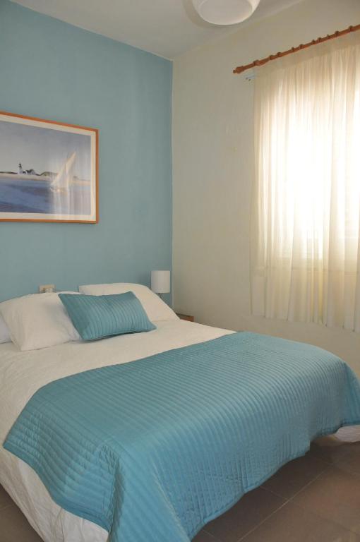 Posteľ alebo postele v izbe v ubytovaní Vivienda Vacacional Paseo Mirabal
