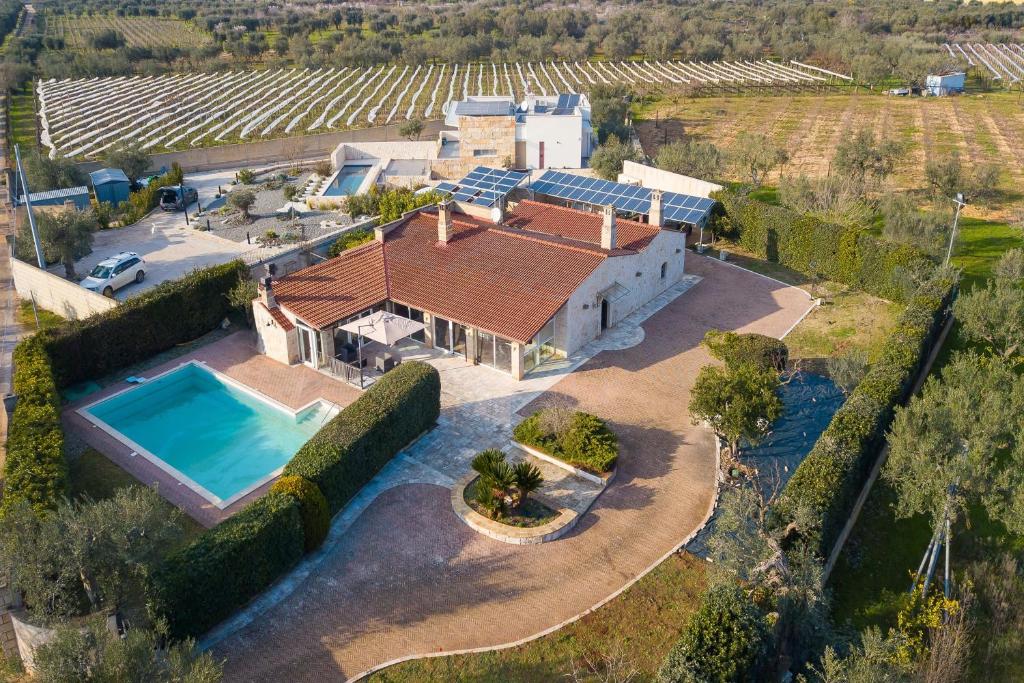 an aerial view of a house with a swimming pool at Masseria Pitorre With Pool - Happy Rentals in Conversano