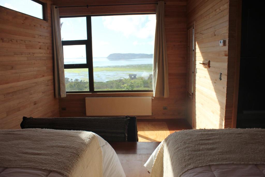 Postel nebo postele na pokoji v ubytování Refugio Pullao