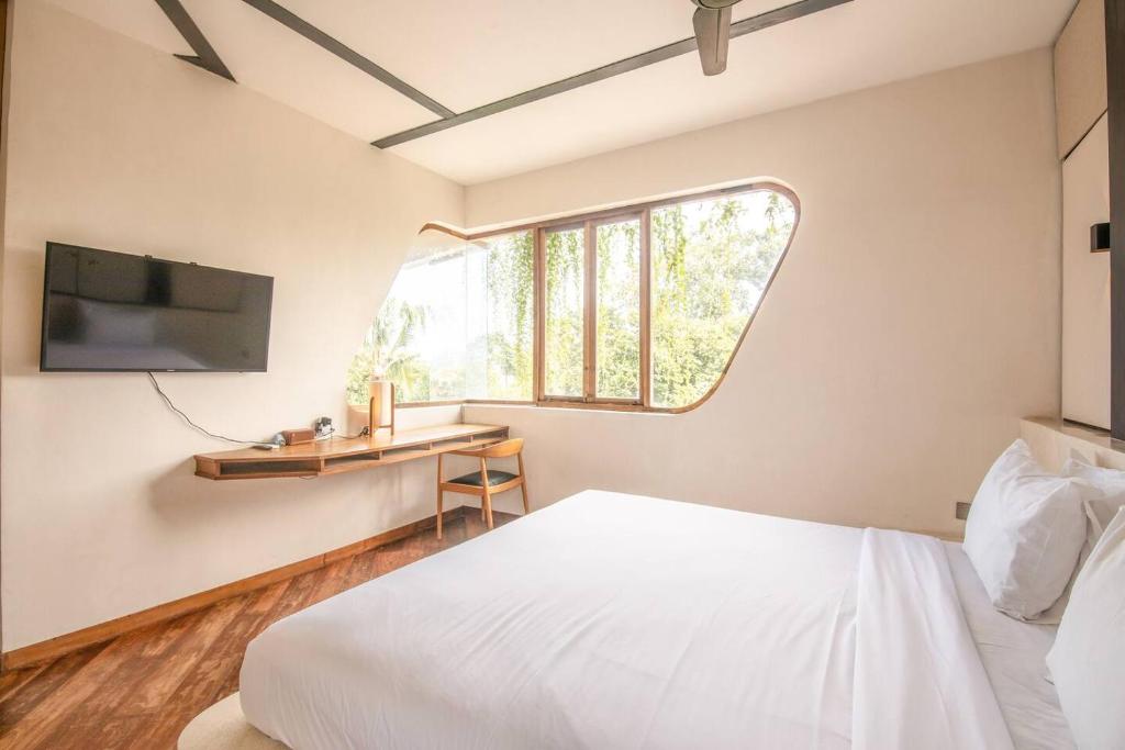 Postel nebo postele na pokoji v ubytování Modern 1-br Loft With Art Deco Vibe Shared Pool