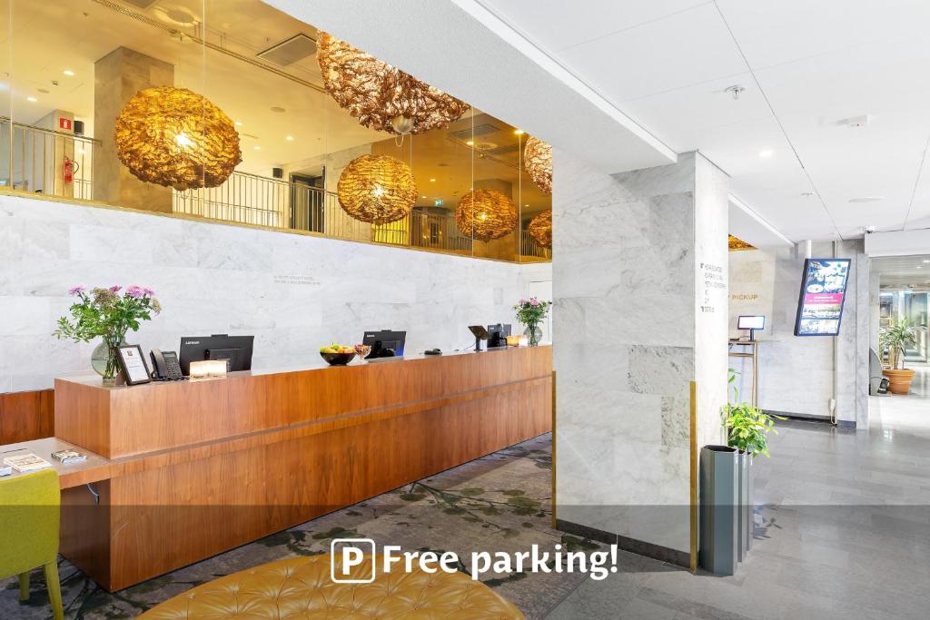 a lobby of a hotel with a reception desk at Best Western Plus Sthlm Bromma in Stockholm