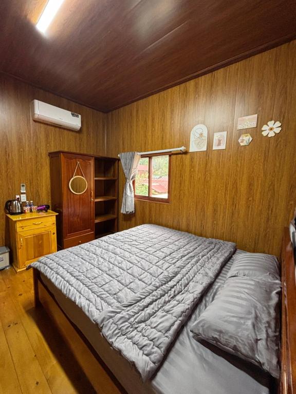 Postel nebo postele na pokoji v ubytování Lam House's Măng Đen