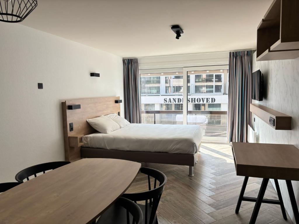 Postel nebo postele na pokoji v ubytování Hotel Sandeshoved Zeedijk