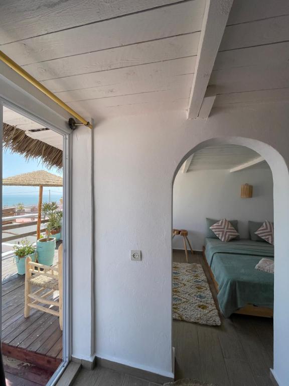 Postel nebo postele na pokoji v ubytování Surf House Lodge