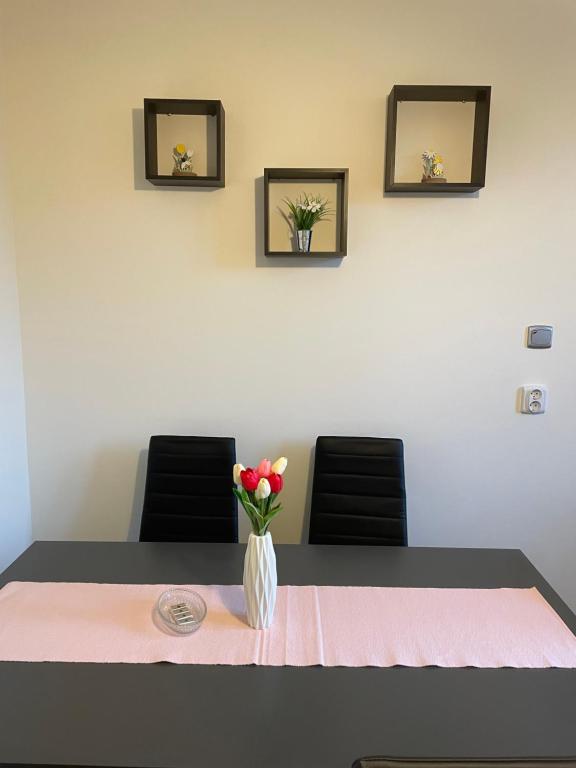 Postel nebo postele na pokoji v ubytování Széchenyi Apartman Esztergom