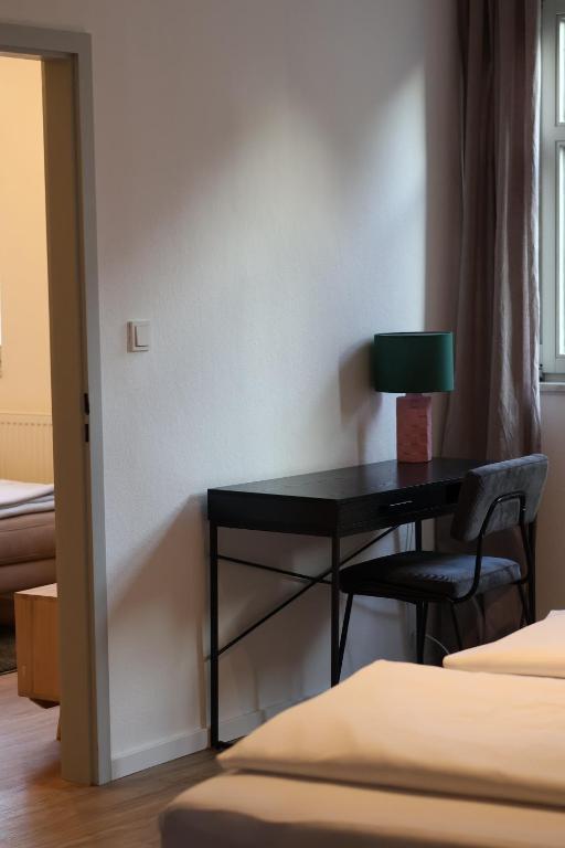 Postel nebo postele na pokoji v ubytování Weinbar & Gästehaus Himmelstoss
