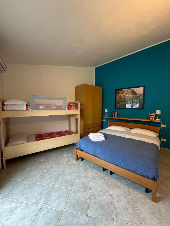 Postel nebo postele na pokoji v ubytování Casa Di Mezzo by Arbaspàa