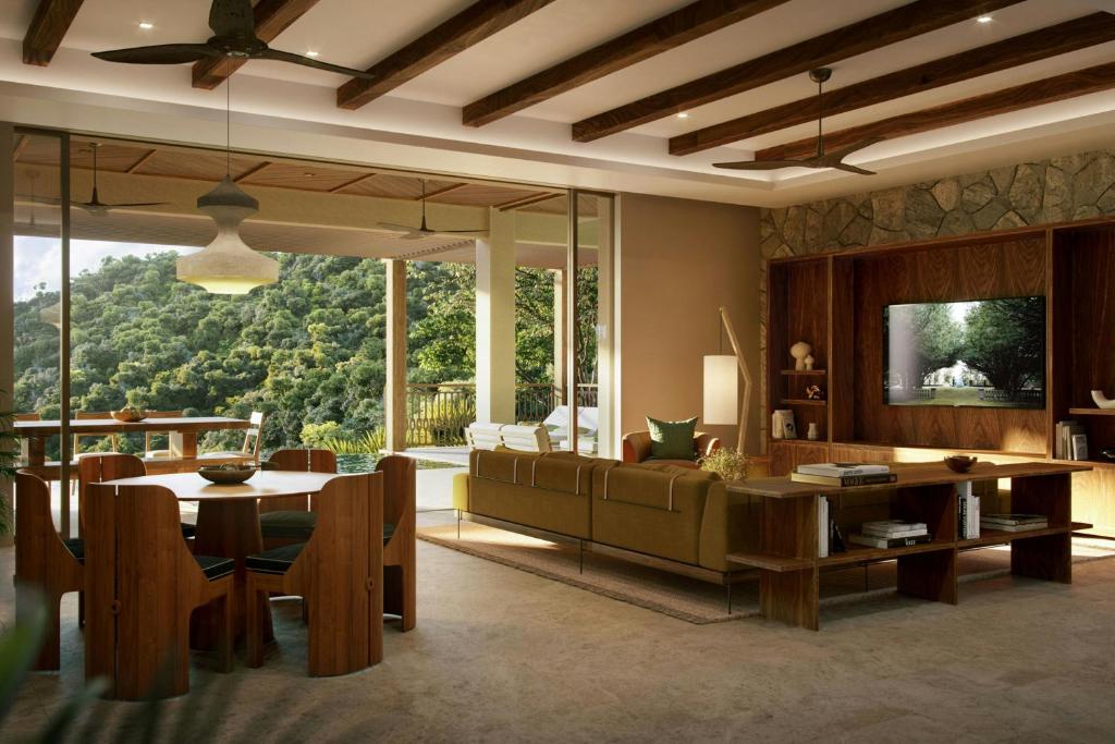 TV a/nebo společenská místnost v ubytování Nekajui, a Ritz-Carlton Reserve