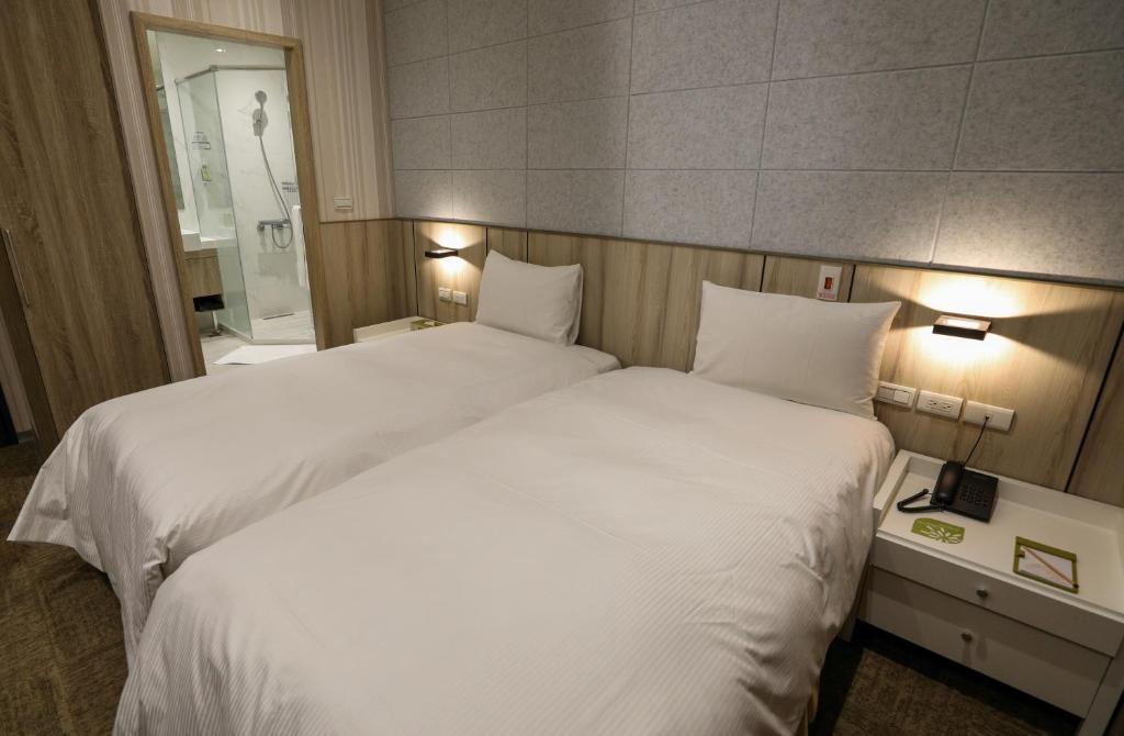 葛瑞丝商旅敦北馆客房内的一张或多张床位