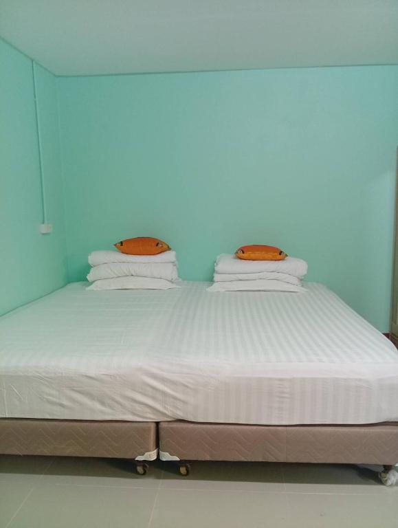 Postel nebo postele na pokoji v ubytování Green Gen Hotel, Mueang Phuket