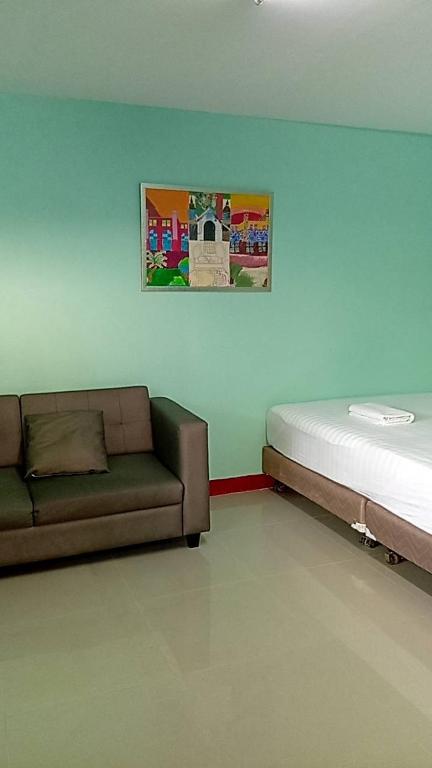 Postel nebo postele na pokoji v ubytování Green Gen Hotel, Mueang Phuket