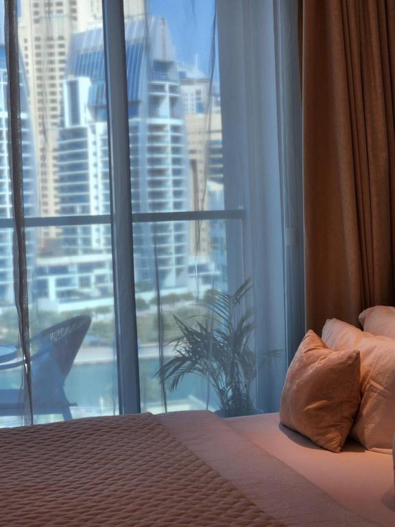Letto o letti in una camera di Studio One Dubai Marina - TIE Vacation Homes