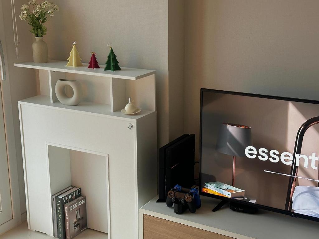 TV a/nebo společenská místnost v ubytování Grape Residence Hotel