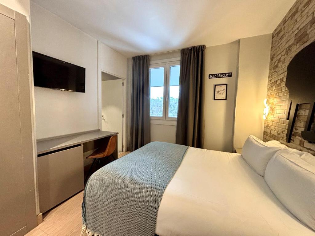 Posteľ alebo postele v izbe v ubytovaní Colectia Hotel Urumea