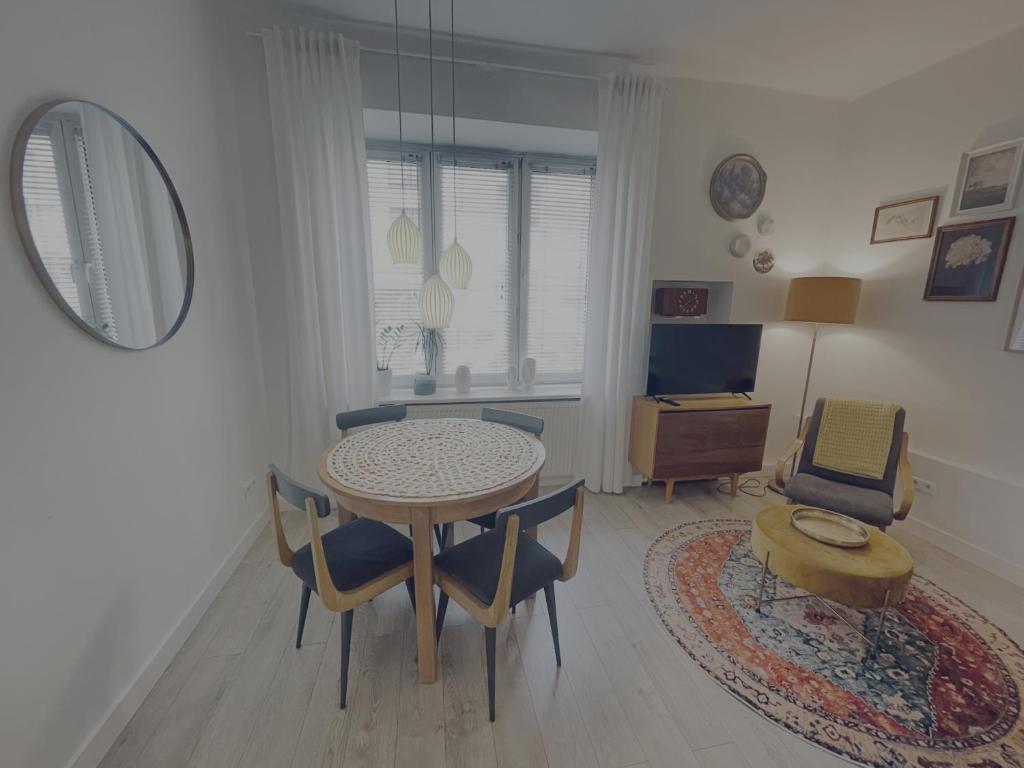 Televízia a/alebo spoločenská miestnosť v ubytovaní Snow White Apartment