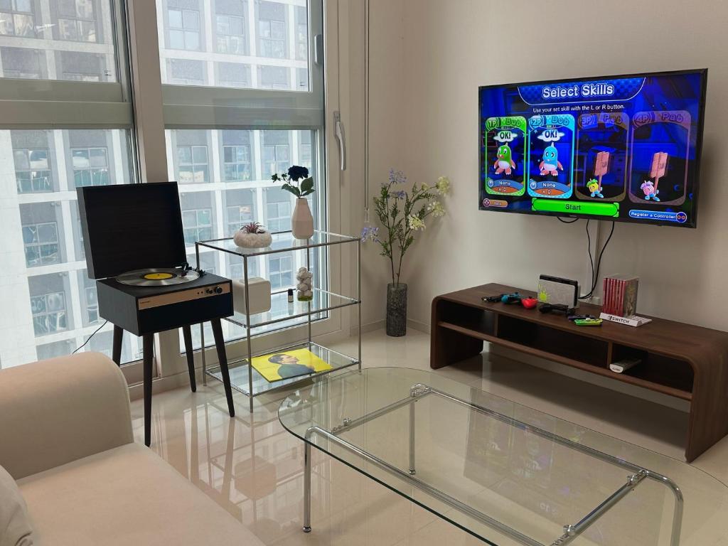 TV a/nebo společenská místnost v ubytování Grape Residence Hotel
