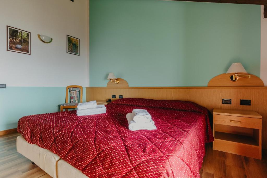 Łóżko lub łóżka w pokoju w obiekcie Hotel Spera
