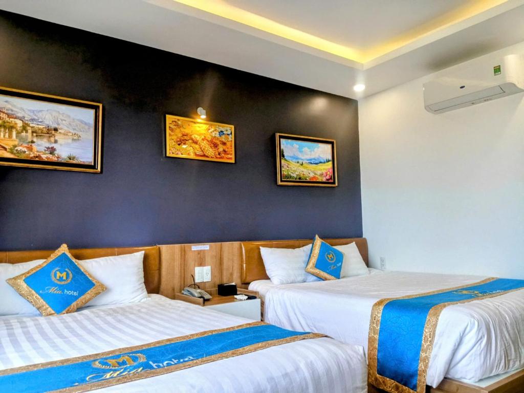 Postel nebo postele na pokoji v ubytování Mia Hotel Vũng Tàu