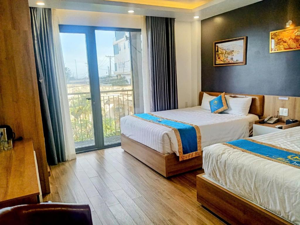 Postel nebo postele na pokoji v ubytování Mia Hotel Vũng Tàu