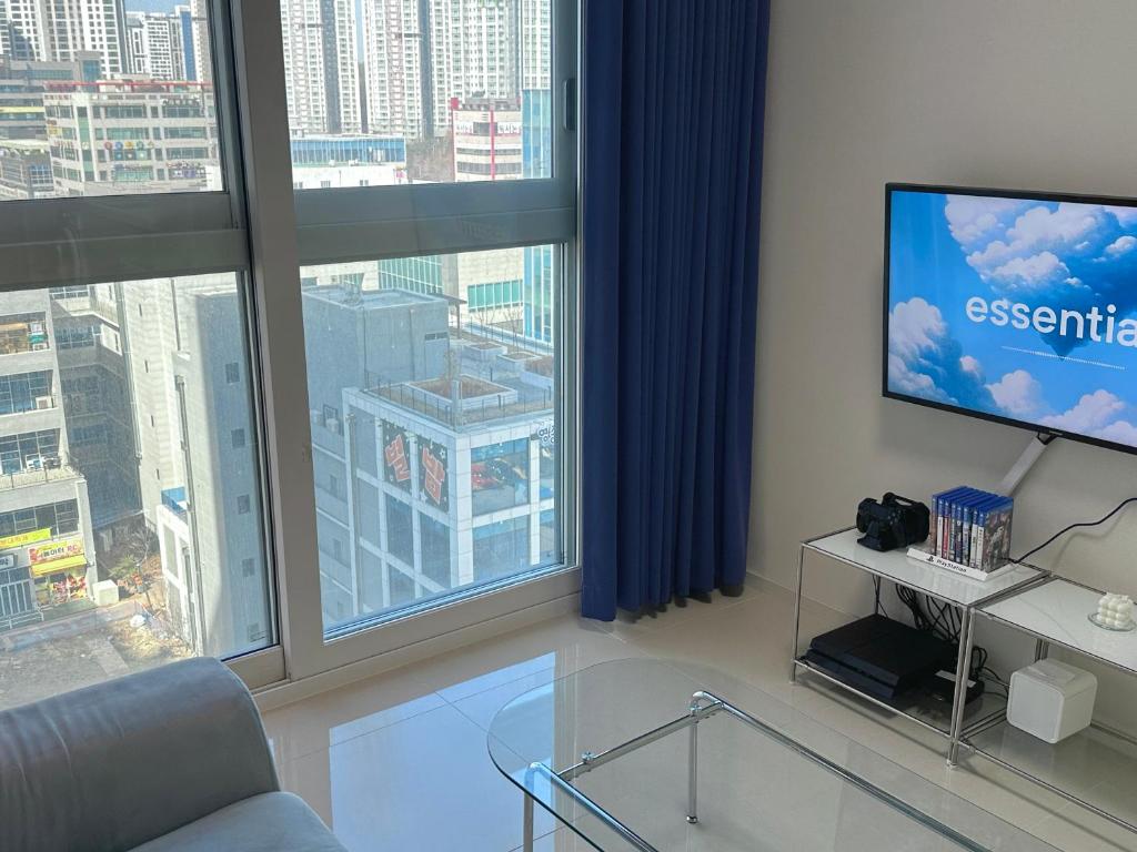 TV a/nebo společenská místnost v ubytování Grape Residence Hotel