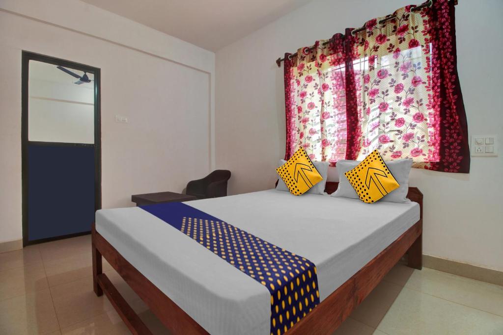 Postel nebo postele na pokoji v ubytování Hotel O U & I LIVINGS