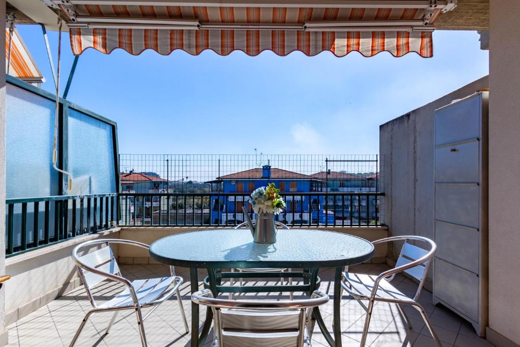 a table and chairs on a balcony with a view at Appartamento Sisto - MyHo Casa in San Salvo