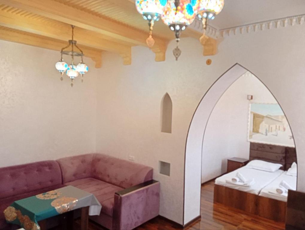 Ένα ή περισσότερα κρεβάτια σε δωμάτιο στο New Hotel Guli