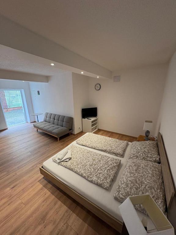 Postel nebo postele na pokoji v ubytování CityApt Wolfik Stockerau