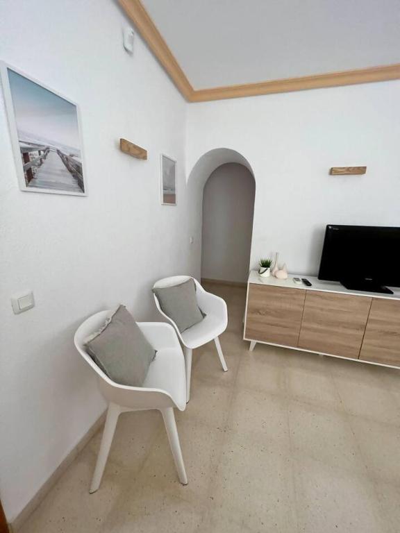 Telewizja i/lub zestaw kina domowego w obiekcie Relaxdiversión en Villa Piscina bbq y cocina ext
